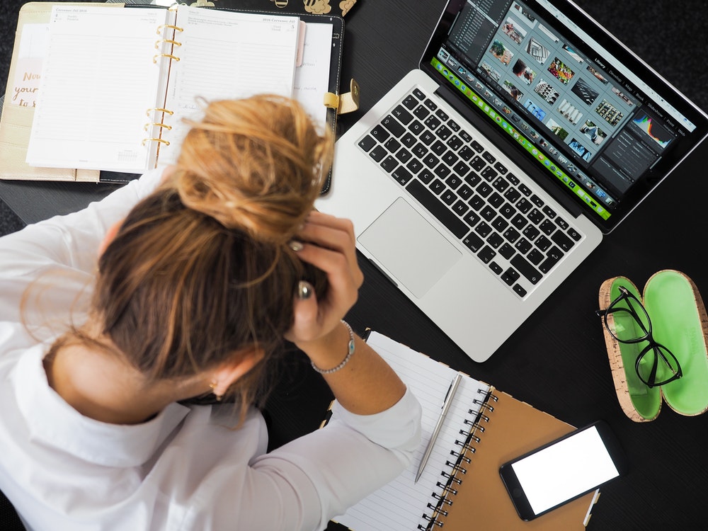 Unhappy woman at a computer