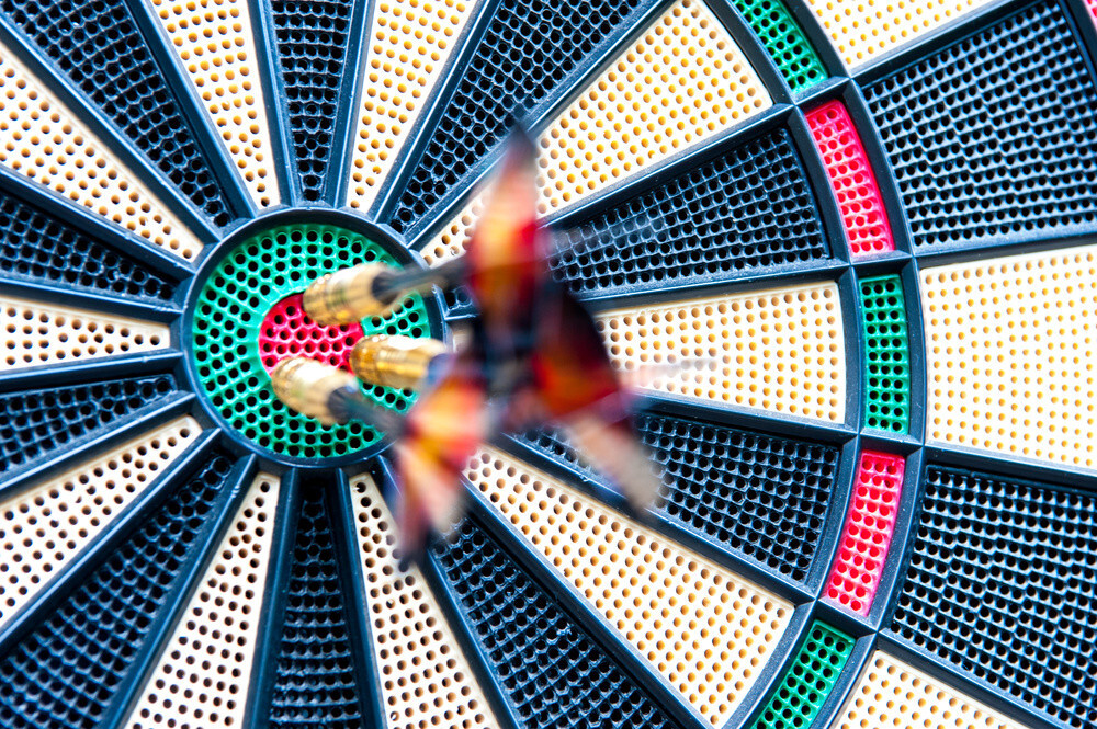 Darts at a dartboard to choose the best IT company