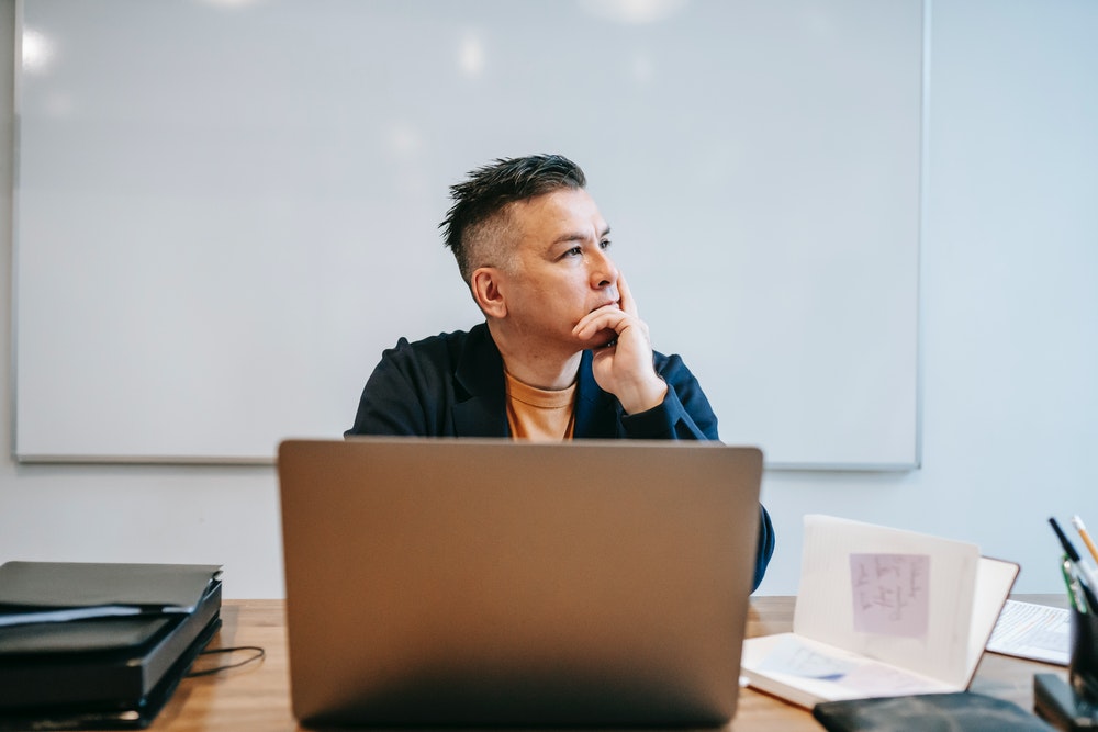 Businessman thinking about which backup service provider to choose