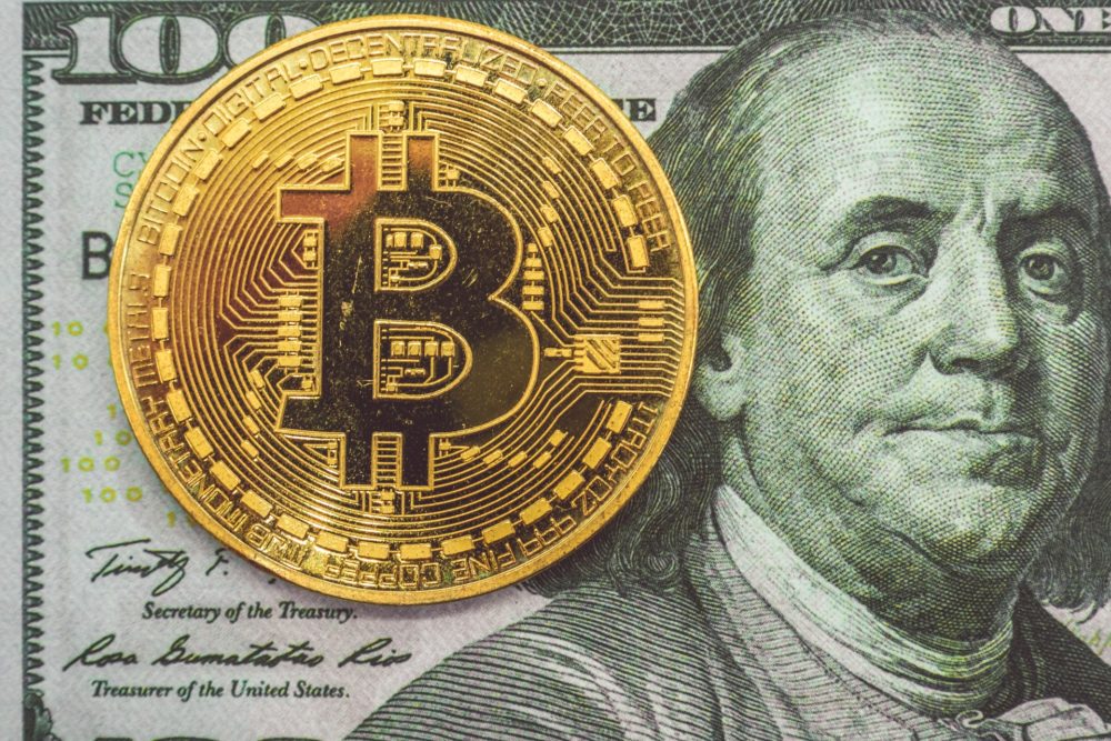 Bitcoin and 100 dollar bill