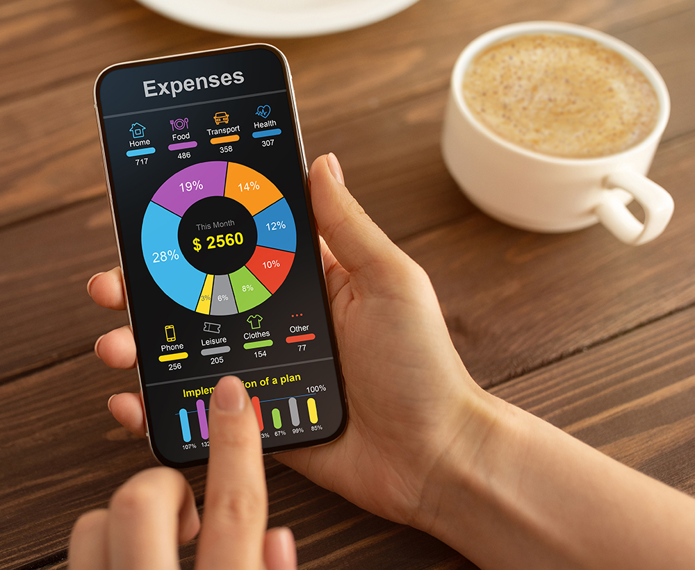 Mobile Phone App For Money, Budget And Expense Tracking concept. Unrecognizable woman checking her monthly expenses.