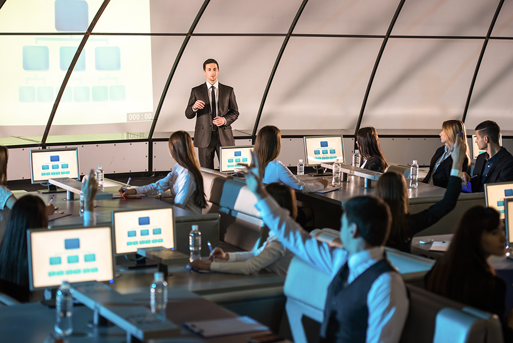 Business conference and presentation. Audience at the modern conference hall.