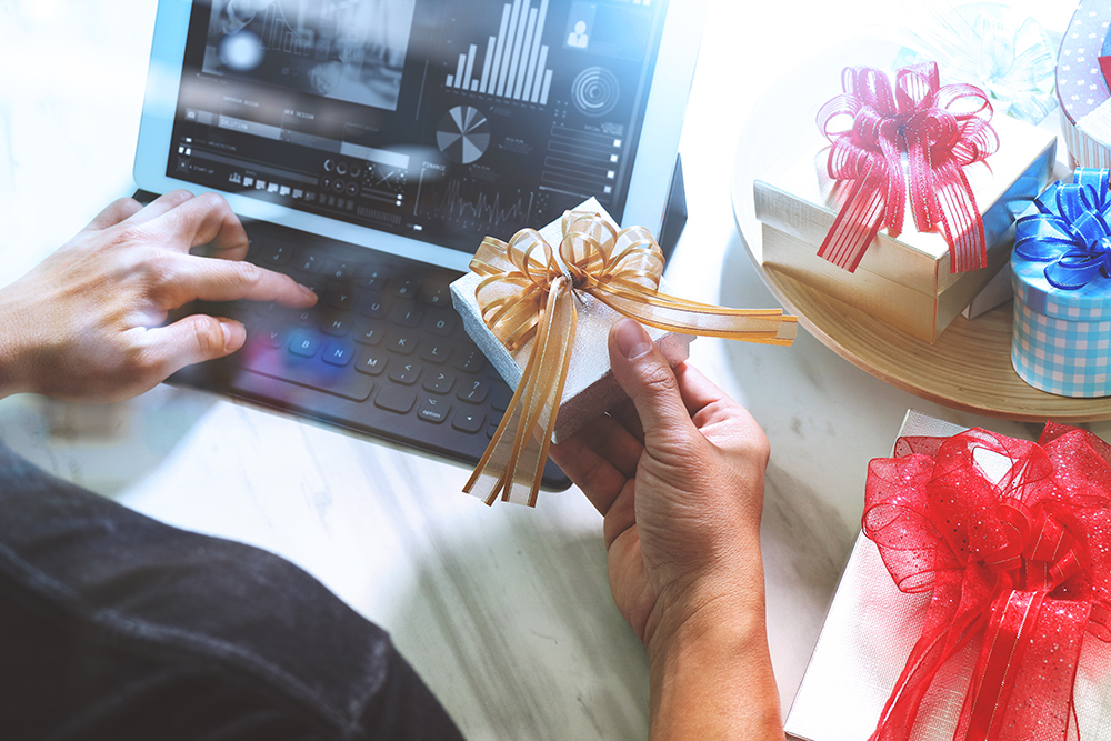 man holding a small gift