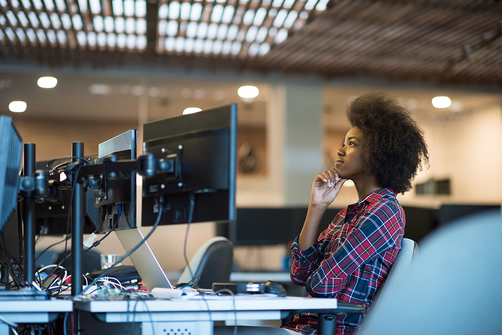 Woman at her workplace in modern office