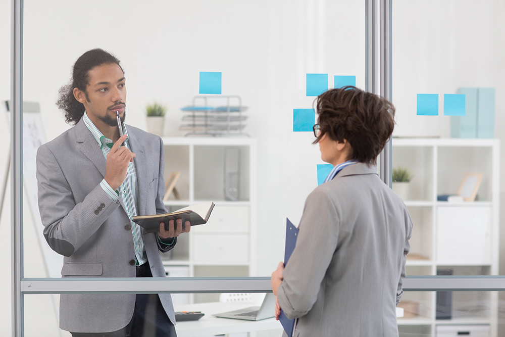 Two people discussing the onboarding process.