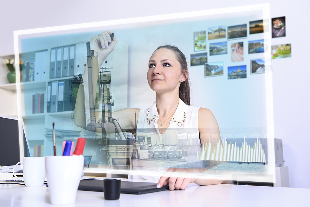 Designer with a virtual futuristic computer at work