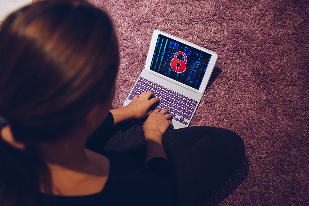 lady trying to use her computer even though it has ransomware