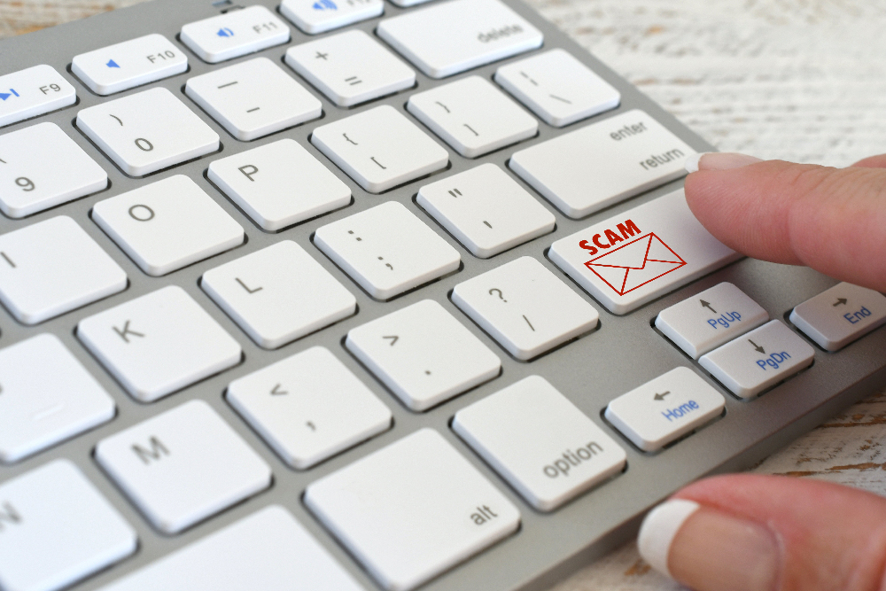 Email scam button on a keyboard