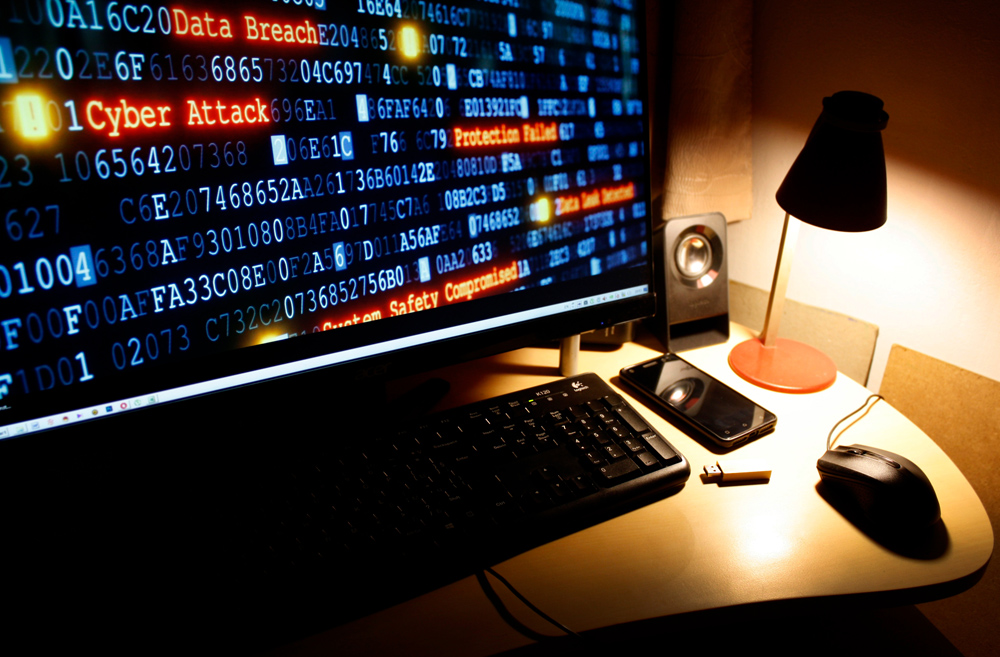 cyber attack and cyber crime on a desktop monitor