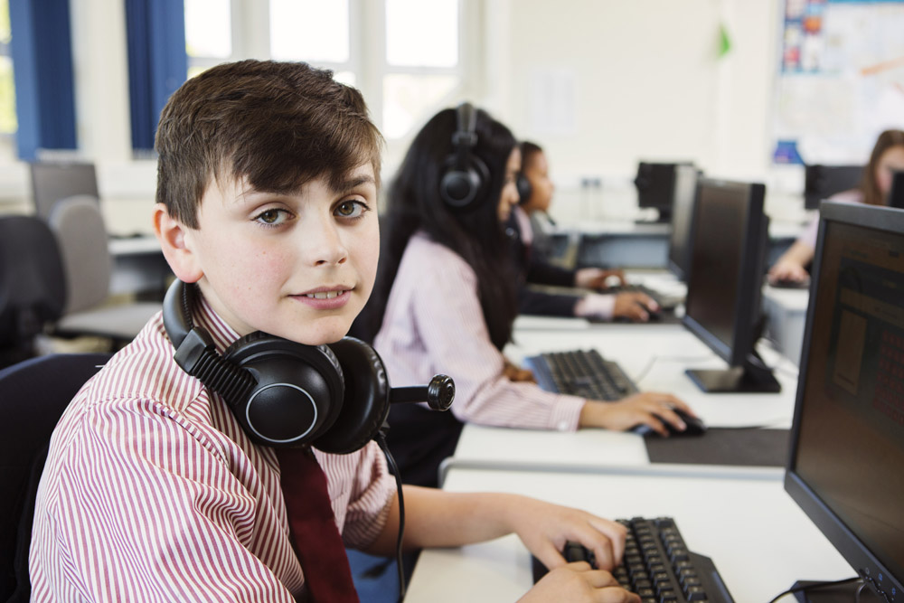 child hacker or script kiddie at a computer