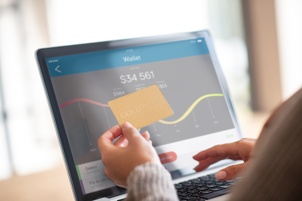 Online bank account. Close up of woman checking balance of bank account online after shopping