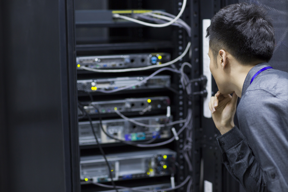 Technician doing maintenance in computer room