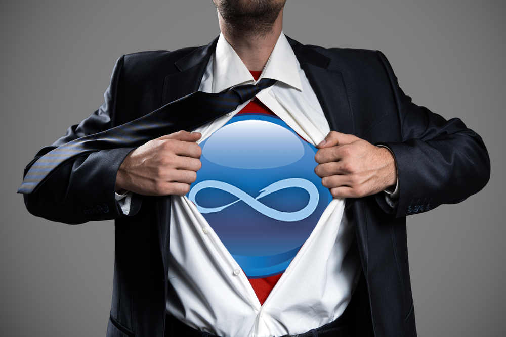 Businessman Acting Like A Super Hero And Tearing His Shirt, to reveal an Infinity Solutions logo.