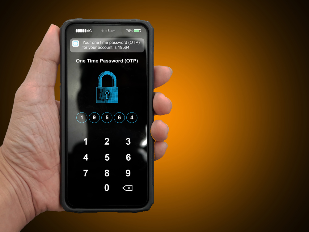 A hand holding a smartphone with filled up one time password for the validation process, Mobile OTP secure verification method, 2-Step authentication.