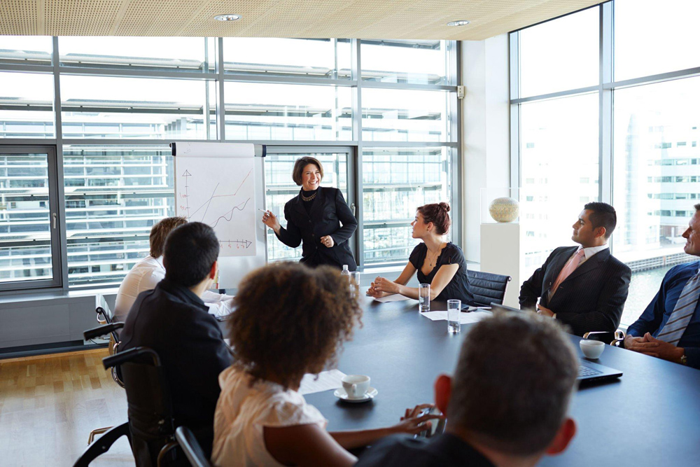 Business meeting going over small business tech challenges strategies