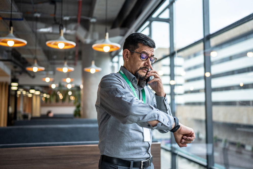 Man checking his watch to make sure he's not late