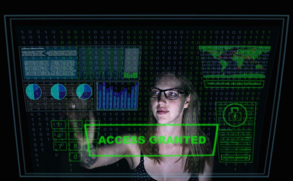 Woman hacker getting access to a business network.